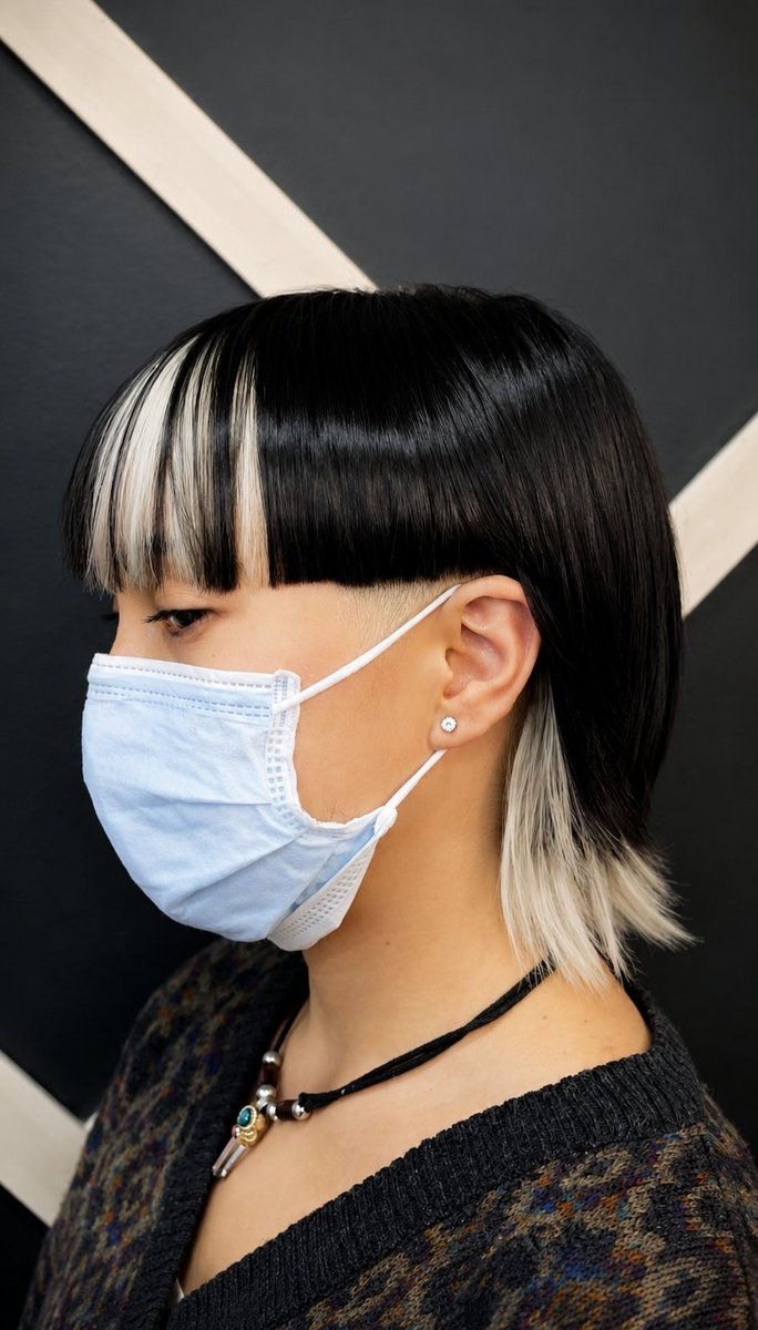 Black bob with white split bangs statement cut at Honeycomb Salon