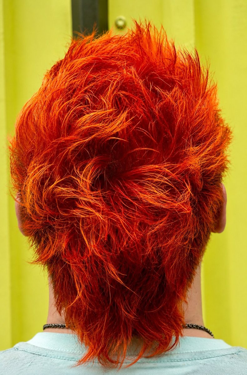 Bold orange red creative color at Honeycomb Salon Northside