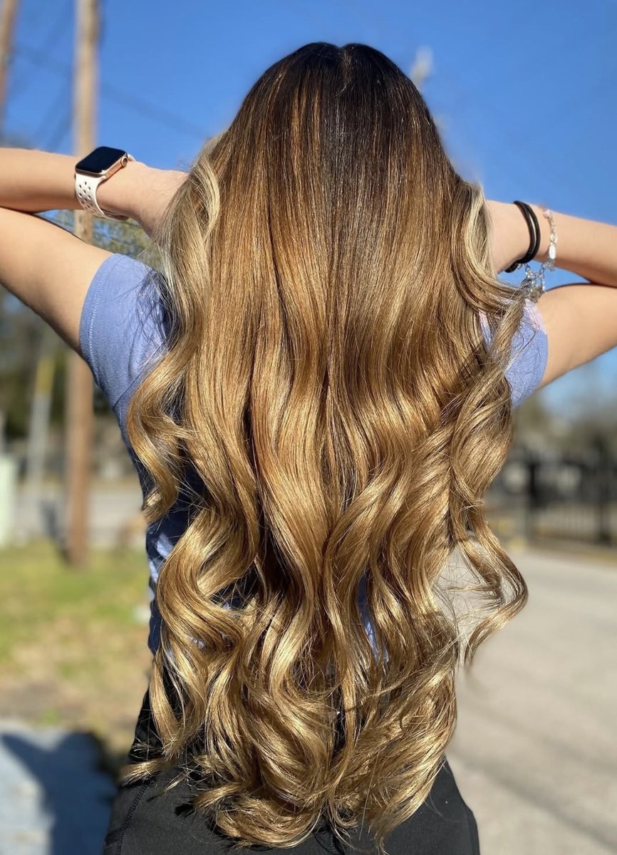 Long brown to blonde ombre color at Honeycomb Salon